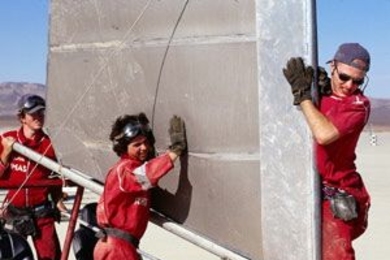 Thomas Massie, Rhett Creighton and Rony Kubat of the Geeks work on their "sand yacht" in a "Junkyard Wars" episode to be broadcast tonight and on June 16. They are vying against another MIT team, a group of alumnae dubbed the Quantum Mechanics.