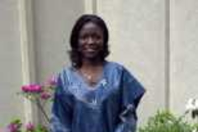 Regina Sam of Ghana in her native dress in the garden of McCormick Hall.