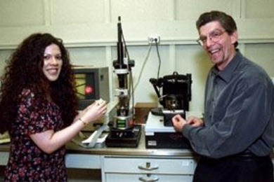 Professors Christine Ortiz and Alan Grodzinsky stand by a new nanomechanical instrument called the molecular force probe that will aid nanoscale studies of cartilage.