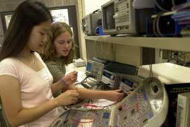 High-school students Kyung Chang of Cairo (left) and Elena Glassman of Pennsylvania work with a circuit board during their electrical engineering class in the Women's Technology Program at MIT.
