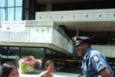 Sgt. Clarence Henniger chats with architecture sophomore Caroline Tien (left) and Julie Koo, a junior in aeronautics and astronautics, on the steps of the Stratton Student Center.Sgt. Clarence Henniger chats with architecture sophomore Caroline Tien (left) and Julie Koo, a junior in aeronautics and astronautics, on the steps of the Stratton Student Center.