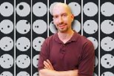 The chart behind Professor of Neuroscience Earl Miller in this photo-composite shows examples of the stimulus displays used to train monkeys to judge whether successive displays contained the same number of items.