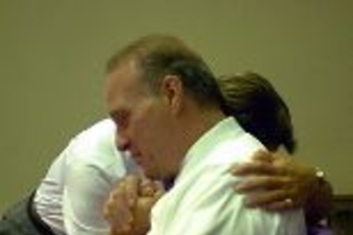 Andrew Macchio, who sang "America the Beautiful" at Ground Zero, shared a tearful moment with MIT Police Sgt. Cheryl Vossmer after watching a video on the rescue efforts.