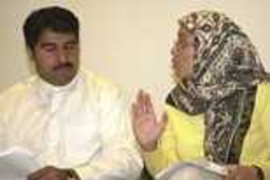 Graduate student Mohammed Saeed, left, performs with Jessica Zaman in a skit he wrote for Wednesday's commemorative event, "Islam in America: Reflecting, Sharing and Understanding."