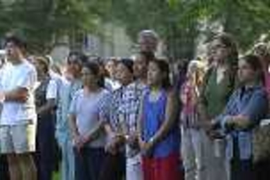 Members of the MIT community listen to President Vest's remarks during Wednesday's flag-lowering ceremony.