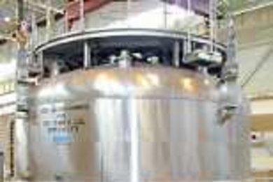 This 150-ton magnet in Japan is crucial to an international experiment  on nuclear fusion (a cover is held above it, ready to be put in place for a test  run)