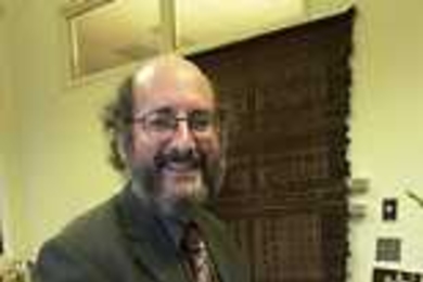 Lawrence Vale, the new head of the Department of Urban Studies and Planning, relaxes in his office.