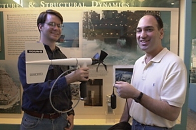 Ocean engineering graduate student Joshua Wilson (left) and Associate Professor Nicholas Makris display a hydrophone that can be used to record sound associated with high winds.