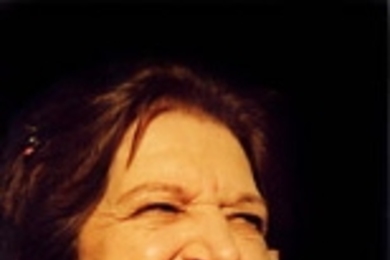 Helen Thomas flashes a rare smile.