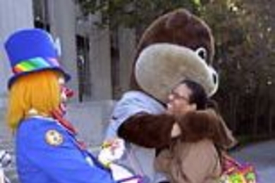 Tracy Daniels gets a hug from Tim the MIT mascot.