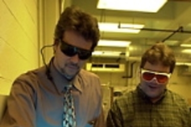 Professor Michael Rubner (left), director of the Center for Materials Science and Engineering, and project technician Tim McClure check the laser in the Raman Spectrometer before setting up an experiment. The spectrometer is part of the center's shared experimental facilities, funded by a $22.2 million NSF grant.
