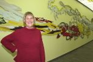 Kathleen Goncharov likens the Z-Center's signature artwork behind her, "Games of Chance and Skill," to "a mini Infinite Corridor."