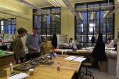 Studio teacher Carol Burns and architecture graduate student Chris Muskopf talk about a model in the new undergraduate architecture studio (Room 7-432).