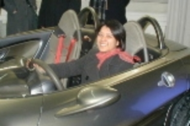 Angela Won, a senior in biology, tries out DaimlerChrysler's F-400 prototype car during the IAP trip to Germany.