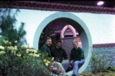 Steve Wiswell (left), Tom Willard (center) and Andy Turcotte take a breather while setting up their entry from Endicott House in the Bayside Expo Flower Show.