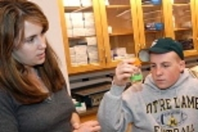 Elizabeth Wiellette, a postdoc associate in the Sive Lab at the MIT-affiliated Whitehead Insitute for Biomedical Research, works with Ryan O'Leary of Holliston High School.