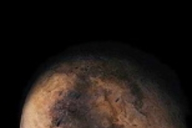 Pluto obstructed by its moon, Charon (lower right).