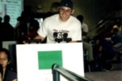 Sophomore Jacob Bourgeois guides his robot toward the platter of street hockey balls.