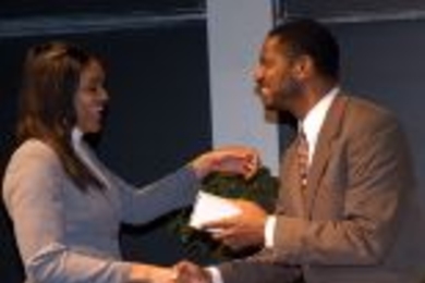 Karl W. Reid, executive director, office of special programs, School of Engineering, congratulates senior Danielle R. Lawrence on winning the Ronald E. McNair Scholarship award.
