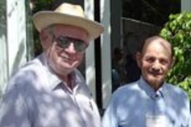 Benoit Mandelbrot (left), the professor of mathematics at Yale University who discovered fractals, chats with MIT Professor Alexander Rich between sessions