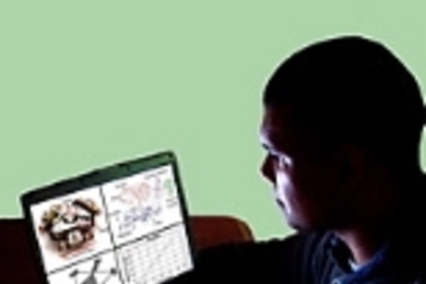 Assistant Professor Martin Culpepper with the HexFlex Nanomanipulator (foreground), which won a 2003 R&amp;D 100 Award.