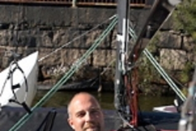 Bob Toabe, a jazz pianist and deck hand at the MIT Sailing Pavillion, relaxes on the Charles River. Toabe will perform today (Oct. 8) in Killian Hall.