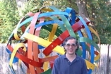 George Hart poses with one of his geometric sculptures.