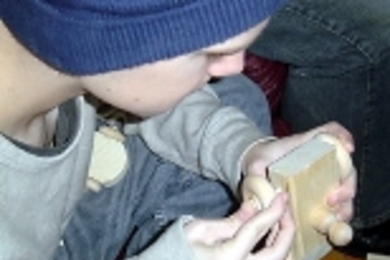 Freshman Evan Taylor builds a toy at Phi Theta Delta.