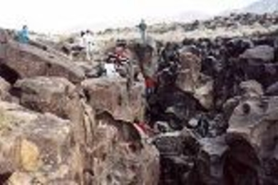 The class does some climbing at California's Fossil Falls, the remains of a waterfall carved by the Owens River thousands of years ago. Students found obsidian chips and places in the rock where women once ground grain at a Native American settlement on the river bank.