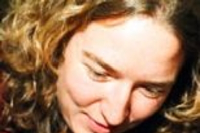 Emily Crapar, an MIT graduate student in aeronautics and astronautics, works on making a tiny chocolate table.