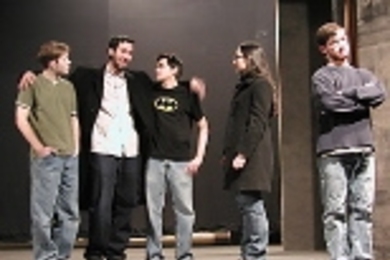 A company of actors, including (left to right) sophomore Kenny Roraback, Aaron Moronez (S.B. 2003), senior Amado Dehoyos, junior Masha Kamenetska and senior Max Goldman, portray a company of actors in Alan Brody's play "Company of Angels."
