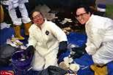 Kelly Johnson, a junior in civil and environmental engineering (left), and freshman Lindsey Sheehan sort through trash on the green near Kresge Auditorium during one of the waste audit sessions in October.