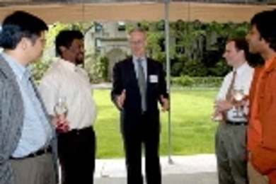 Faculty gathered at Gray House last week to celebrate faculty members who received promotions in 2003-04. Left to right: Gang Chen of mechanical engineering, who was promoted to full professor; Saman Amarasinghe of electrical engineering and computer science (EECS), promoted to associate professor with tenure; President Charles M. Vest; and David Perreault of EECS, and Arindam Dutta of architectur...