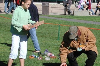 Shoppers browse the MIT Glass Lab's glass pumpkin patch.