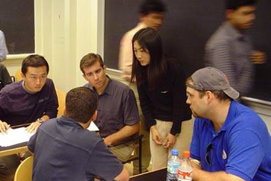 Members of the Fuel Cell Breakthrough i-Team plan their strategy. From left, Jin Yi; Brett Prince  (with back to camera); Matt Ziskin;, principal investigator Yang Shao-Horn, professor of mechanical engineering; and Jeff Baer.
