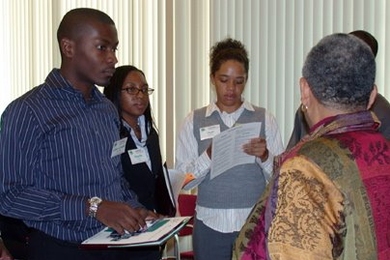 Left to right: Gille-Arnaud Bleu-Laine from Georgia Tech, Manelle Samuels from the University of Hartford and Shani Matthews from Spelman College speak to Ayida Mthembu, associate dean of counseling and support services, during an information session during the graduate student recruiting weekend, Converge.