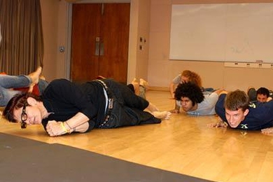 Elizabeth Streb, left, demonstrates extreme movement to students while visiting MIT as an artist in residence and Abramovitz lecturer.