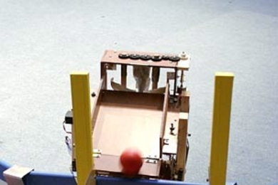 The fifth ball is still halfway up the Archimedes screw when this picture was taken. "We knew it took a little over 20 seconds to lift a ball up, so we programmed the robot to remember the last time it picked up a ball and not leave the goal until 30 seconds after this time, if it docked early," said team member Andrew Spann. "The robot docked with about a minute of time remaining, then waited unt...