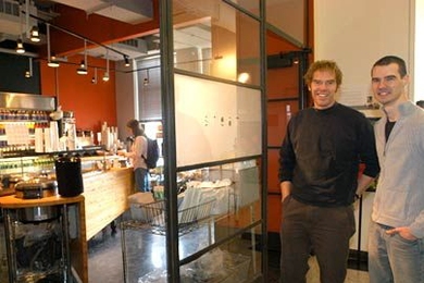 Architecture graduate students Scott Francisco, left, and Nick Senske spearhead the design and menu of the new Steam Cafe, located on the fourth floor of MIT's Building 7.