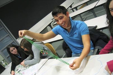 Eleventh-grader Nick Tetreault of Hudson High School examines a model of a mitotic spindle at MIT on March 23. Tetreault was one of dozens of high school biology students who visited the Institute during spring break to see what graduate work in the field is like.