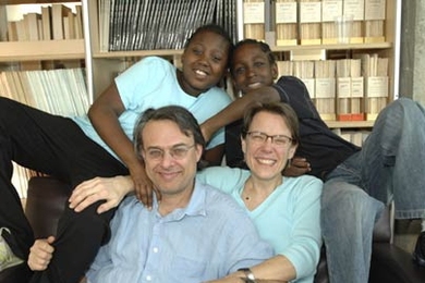 Sally Haslanger, professor of linguistics and philosophy, shares a warm moment with her family--husband Steve Yablo and their two children, Zina, left, and Isaac, both of whom are adopted. Haslanger recently co-edited 'Adoption Matters,' a book about adoption.