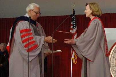 At her inauguration as 16th president of MIT, Susan Hockfield accepts the university charter from Dana Mead, chairman of the MIT Corporation.