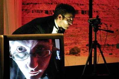 Image from Tennessee Williams' 'Demolition Downtown,' an MIT Dramashop performance directed by MIT professor Jay Schieb, showing the use of video cameras and screens on stage.