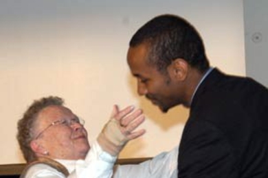Priscilla Gray hugs John Pope '05, winner of the Priscilla King Gray Award for Public Service, at the Awards Convocation on May 10.