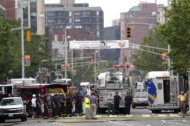 Emergency vehicles line Massachusetts Avenue during the afternoon Monday, June 13, after an Nstar equipment failure sparked an underground fire. By 5:30 p.m., the fire was out. No injuries were reported, but thousands lost power.