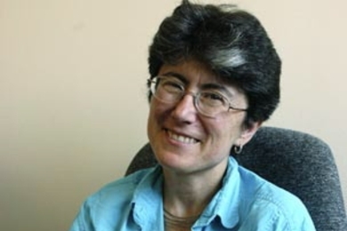 Elizabeth Wood, associate professor of history, holds up her new book, 'Performing Justice: Agitation Trials in Early Soviet Russia.'