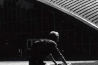 A bicyclist passes by Kresge Auditorium on the MIT campus.