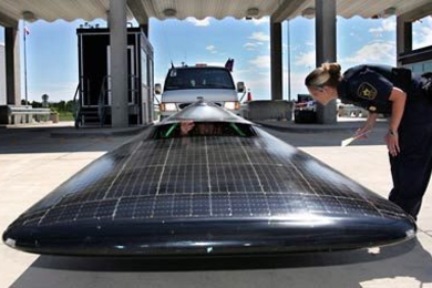 MIT's solar car Tesseract, which recently place third in the North American Solar Challenge, crosses the border at Winnipeg, Manitoba.