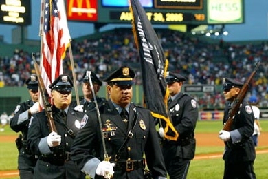 MIT's own police officers carry the colors on the field before the Red Sox game at Fenway Park on Tuesday, Aug. 30. Clockwise from center are Lt. Daniel Costa and Patrol Officers David Sacco, William Smith, Kevin O'Connor, Brian Sousa and Robert Molina.
