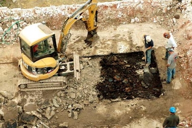 It's out with the old to make way for the new as construction workers labor away on the PDSI project Monday.